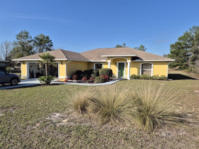 360 Marion Oaks Golf Way, Ocala, FL 34473 - single story home featuring stucco siding, a front yard, an attached garage, and driveway