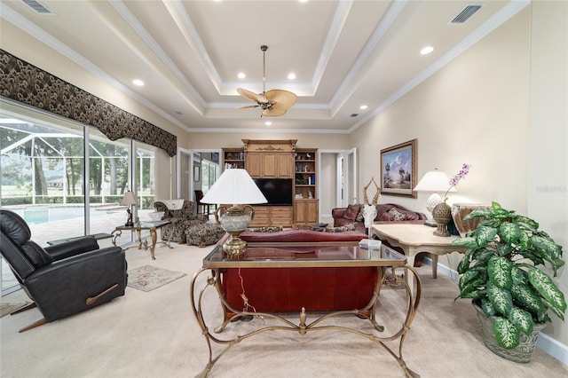 7915 SE 12th Cir, Ocala, FL 34480 - living area with light carpet, a sunroom, ceiling fan, recessed lighting, and crown molding