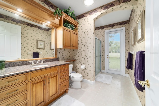 7915 SE 12th Cir, Ocala, FL 34480 - full bathroom featuring wallpapered walls, toilet, a shower stall, vanity, and tile patterned floors