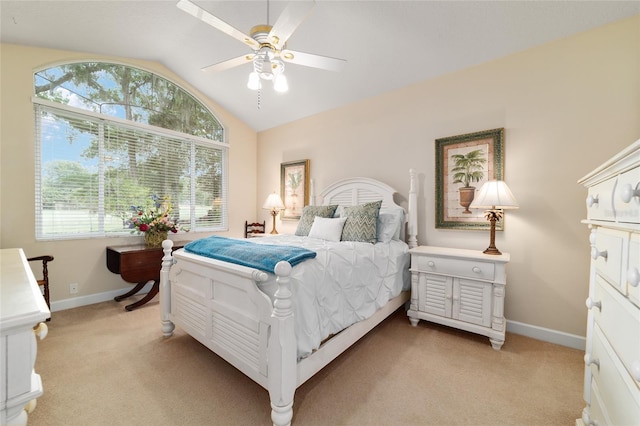 7915 SE 12th Cir, Ocala, FL 34480 - bedroom with lofted ceiling, light carpet, baseboards, and a ceiling fan