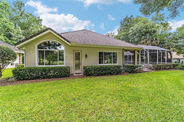 7915 SE 12th Cir, Ocala, FL 34480 - view of front facade with stucco siding, a front yard, a tile roof, and a lanai