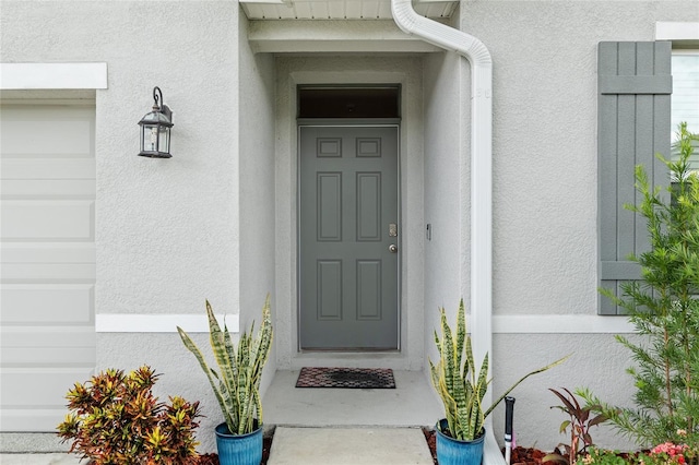 32 Hickory Course Loop, Ocala, FL 34472 - view of exterior entry featuring stucco siding