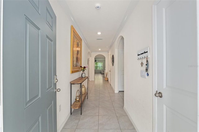 32 Hickory Course Loop, Ocala, FL 34472 - hall with arched walkways, light tile patterned flooring, baseboards, crown molding, and recessed lighting