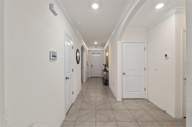 32 Hickory Course Loop, Ocala, FL 34472 - hallway featuring arched walkways, crown molding, light tile patterned floors, baseboards, and recessed lighting