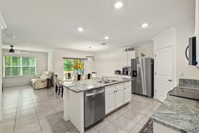 32 Hickory Course Loop, Ocala, FL 34472 - kitchen with appliances with stainless steel finishes, a sink, ornamental molding, white cabinetry, and open floor plan
