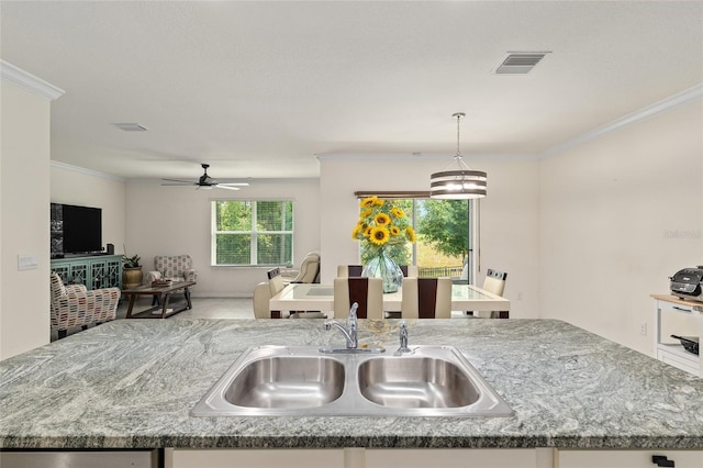 32 Hickory Course Loop, Ocala, FL 34472 - kitchen with a sink, open floor plan, ornamental molding, decorative light fixtures, and ceiling fan