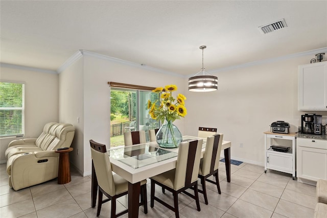 32 Hickory Course Loop, Ocala, FL 34472 - dining space featuring light tile patterned floors, crown molding, and baseboards