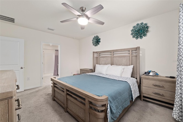 32 Hickory Course Loop, Ocala, FL 34472 - bedroom featuring light colored carpet, a ceiling fan, ensuite bath, and baseboards