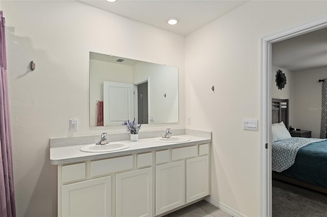32 Hickory Course Loop, Ocala, FL 34472 - ensuite bathroom featuring double vanity and baseboards