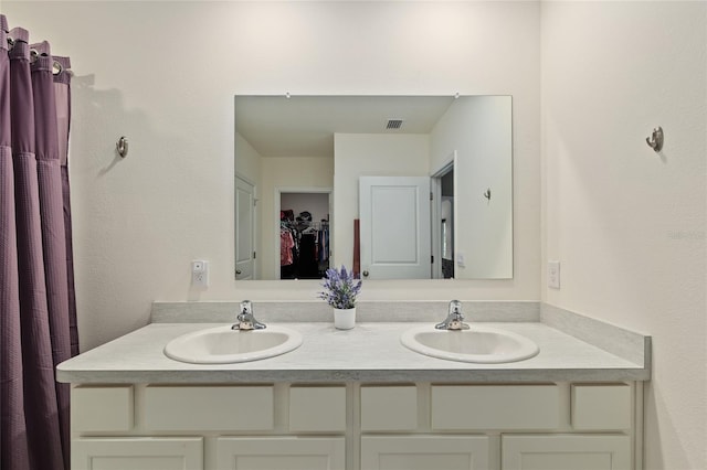 32 Hickory Course Loop, Ocala, FL 34472 - bathroom with double vanity and a walk in closet