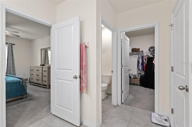 32 Hickory Course Loop, Ocala, FL 34472 - corridor with light carpet, light tile patterned floors, and baseboards