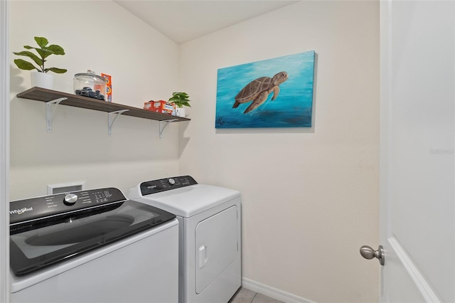 32 Hickory Course Loop, Ocala, FL 34472 - laundry area featuring washer and dryer, baseboards, and light tile patterned floors