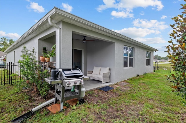 32 Hickory Course Loop, Ocala, FL 34472 - view of home's exterior with a ceiling fan, a patio, stucco siding, and outdoor lounge area