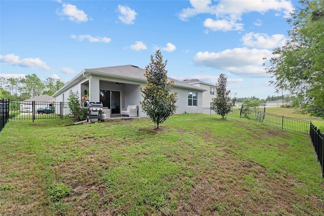 32 Hickory Course Loop, Ocala, FL 34472 - back of house featuring stucco siding and a patio area