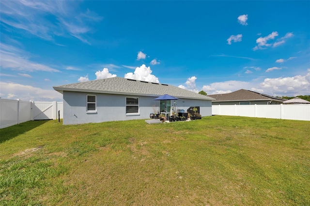 3418 SW 155th Pl, Ocala, FL 34473 - back of house with stucco siding, a gate, and roof with shingles