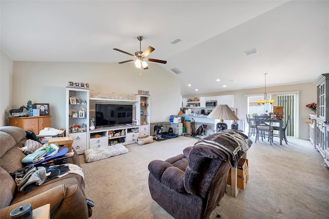 3418 SW 155th Pl, Ocala, FL 34473 - living area with light colored carpet, a chandelier, vaulted ceiling, a ceiling fan, and recessed lighting