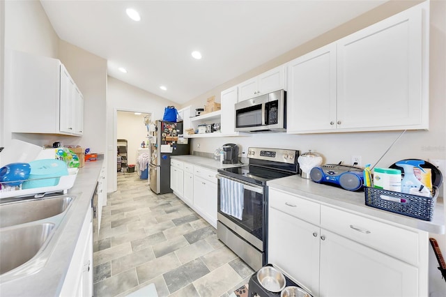 3418 SW 155th Pl, Ocala, FL 34473 - kitchen with stainless steel appliances, light countertops, a sink, recessed lighting, and white cabinetry