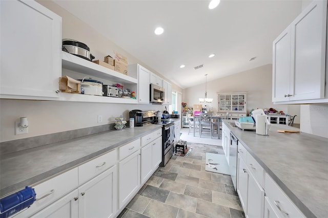 3418 SW 155th Pl, Ocala, FL 34473 - kitchen featuring appliances with stainless steel finishes, lofted ceiling, white cabinetry, recessed lighting, and open shelves