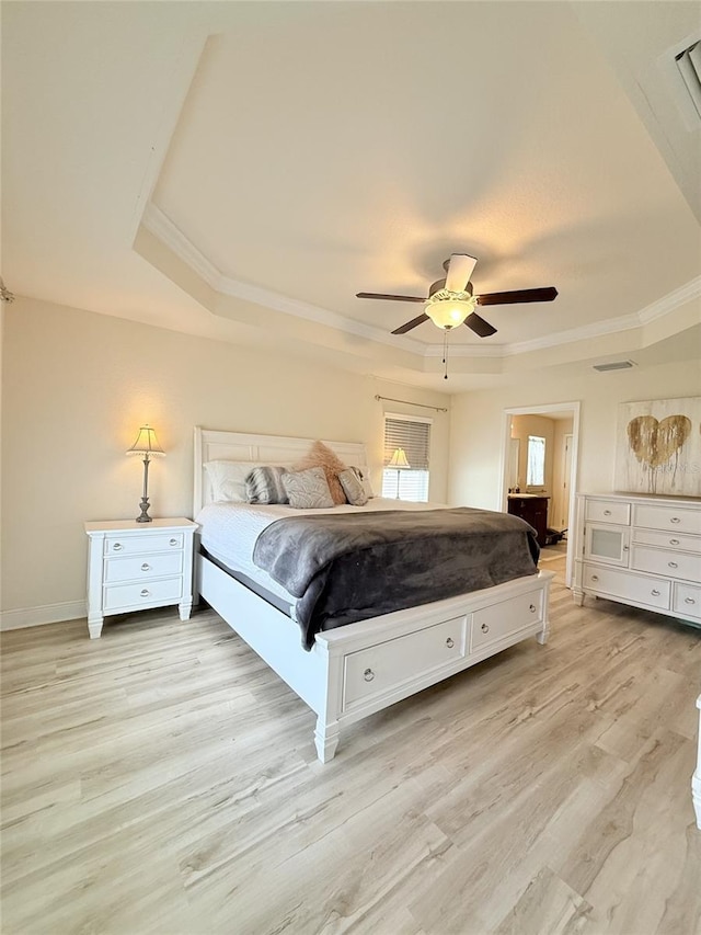 186 NW 44th St, Ocala, FL 34475 - bedroom featuring a raised ceiling, crown molding, light wood-type flooring, and ceiling fan