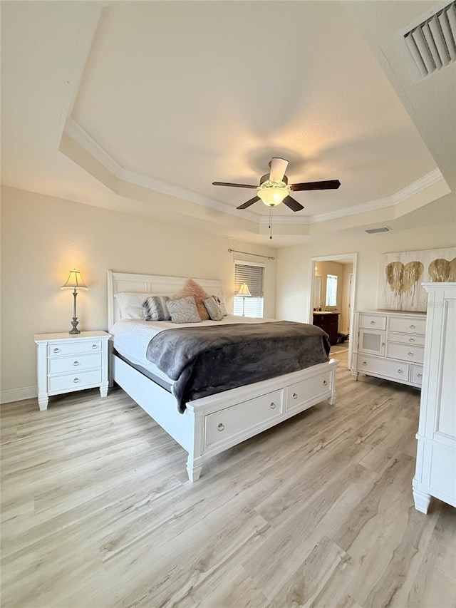 186 NW 44th St, Ocala, FL 34475 - bedroom featuring a tray ceiling, light wood finished floors, ornamental molding, and a ceiling fan