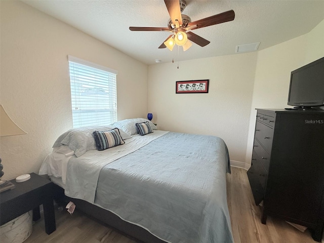 186 NW 44th St, Ocala, FL 34475 - bedroom with wood finished floors and a ceiling fan