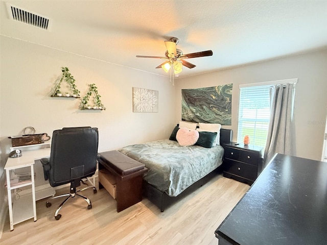 186 NW 44th St, Ocala, FL 34475 - bedroom featuring wood finished floors, an office area, and a ceiling fan
