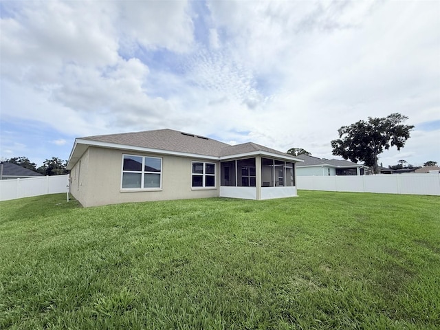 186 NW 44th St, Ocala, FL 34475 - back of property with a sunroom, a fenced backyard, and stucco siding