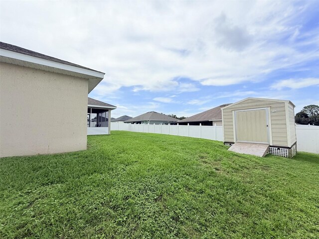 186 NW 44th St, Ocala, FL 34475 - view of yard featuring a sunroom and a storage shed