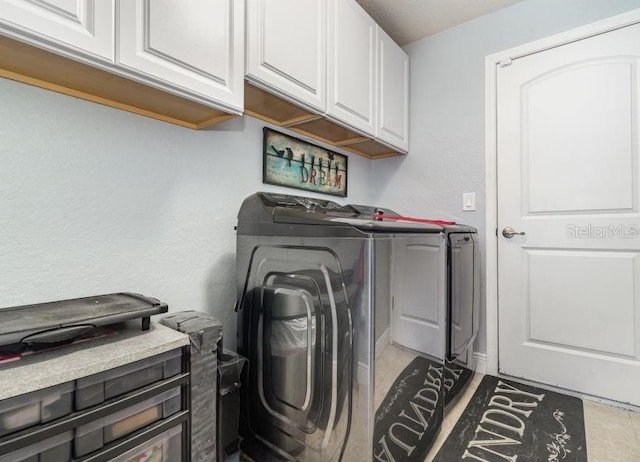 186 NW 44th St, Ocala, FL 34475 - laundry room featuring washing machine and dryer and cabinet space
