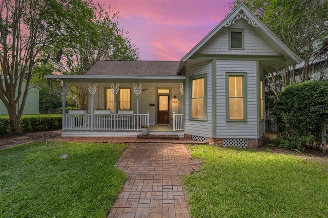 828 SE 3rd St, Ocala, FL 34471 - victorian-style house featuring covered porch, a yard, crawl space, and a shingled roof