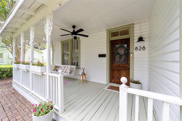 828 SE 3rd St, Ocala, FL 34471 - wooden porch with a ceiling fan