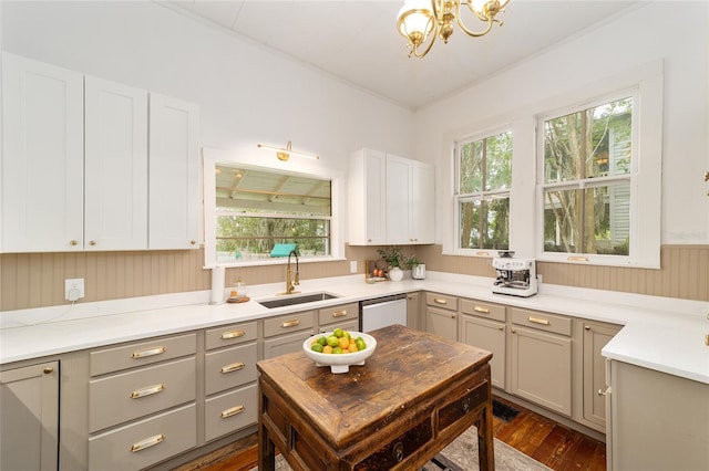 828 SE 3rd St, Ocala, FL 34471 - kitchen with a sink, dishwasher, gray cabinetry, a chandelier, and plenty of natural light