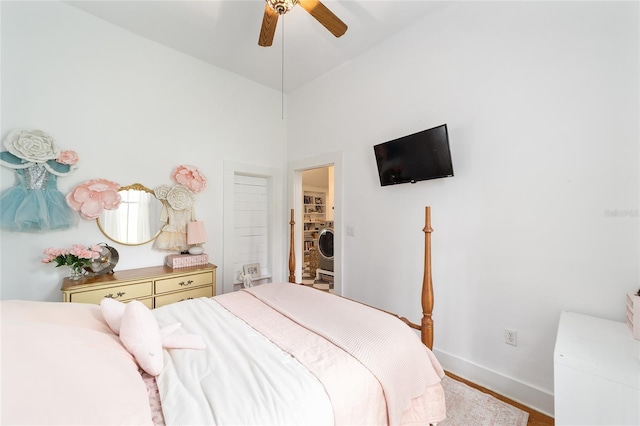 828 SE 3rd St, Ocala, FL 34471 - bedroom with baseboards, washer / clothes dryer, ceiling fan, and wood finished floors