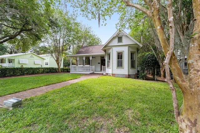 828 SE 3rd St, Ocala, FL 34471 - victorian home with covered porch and a front yard
