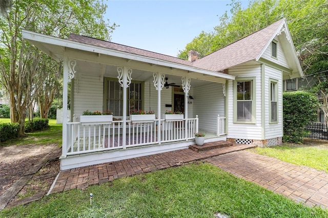 828 SE 3rd St, Ocala, FL 34471 - view of front of property featuring covered porch, a chimney, and roof with shingles