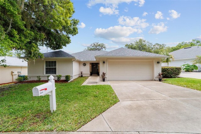 2644 SW 20th Cir, Ocala, FL 34471 - single story home featuring stucco siding, an attached garage, concrete driveway, a front lawn, and a shingled roof