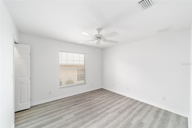2644 SW 20th Cir, Ocala, FL 34471 - unfurnished room with light wood-type flooring, a ceiling fan, and baseboards