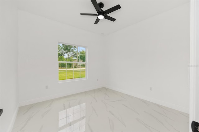 8456 SE 164th Pl, Summerfield, FL 34491 - empty room featuring baseboards, marble finish floors, and a ceiling fan