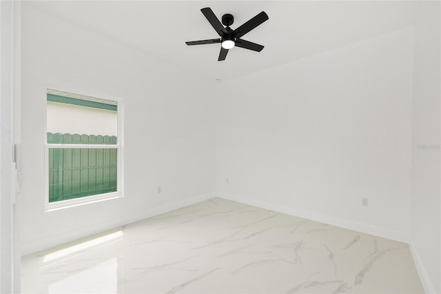 8456 SE 164th Pl, Summerfield, FL 34491 - unfurnished room featuring marble look tile flooring, ceiling fan, and baseboards