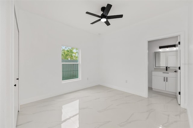 8456 SE 164th Pl, Summerfield, FL 34491 - unfurnished room featuring baseboards, ceiling fan, and light marble finish floors