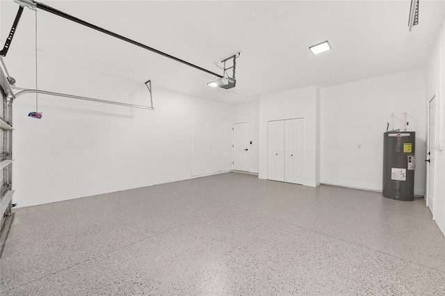 8456 SE 164th Pl, Summerfield, FL 34491 - garage featuring water heater and a garage door opener
