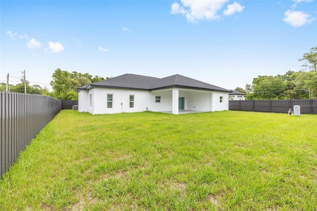 8456 SE 164th Pl, Summerfield, FL 34491 - rear view of property with stucco siding