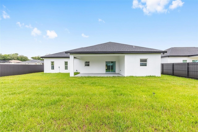 8456 SE 164th Pl, Summerfield, FL 34491 - rear view of house with a patio, stucco siding, and a shingled roof