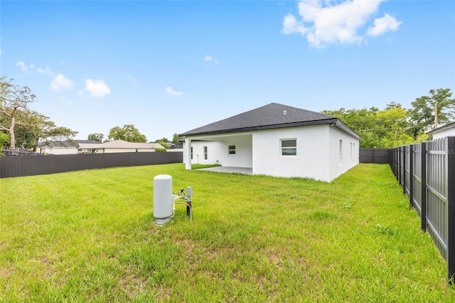 8456 SE 164th Pl, Summerfield, FL 34491 - back of property with stucco siding and a patio