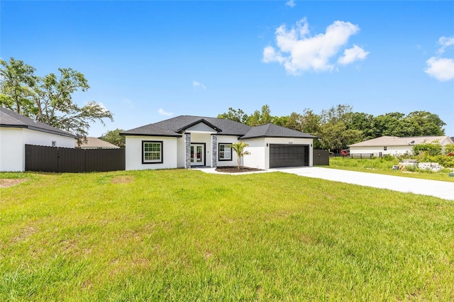 8456 SE 164th Pl, Summerfield, FL 34491 - view of front of home featuring french doors, driveway, an attached garage, and stucco siding