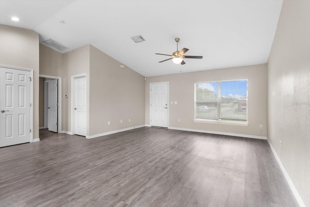17277 SW 44th Cir, Ocala, FL 34473 - unfurnished living room with vaulted ceiling, ceiling fan, wood finished floors, and baseboards