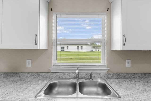 17277 SW 44th Cir, Ocala, FL 34473 - kitchen view of a sink and white cabinets