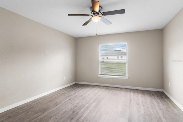 17277 SW 44th Cir, Ocala, FL 34473 - spare room with wood finished floors, a ceiling fan, and baseboards
