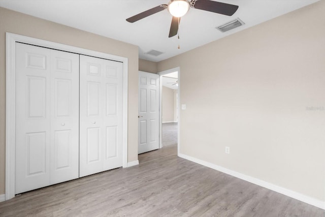 17277 SW 44th Cir, Ocala, FL 34473 - unfurnished bedroom with baseboards, wood finished floors, and a closet
