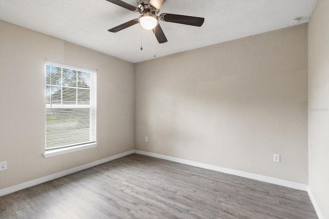 17277 SW 44th Cir, Ocala, FL 34473 - unfurnished room featuring plenty of natural light, wood finished floors, and baseboards